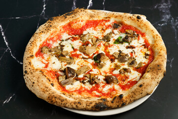 Neapolitan pizza with porcini mushrooms and mozzarella