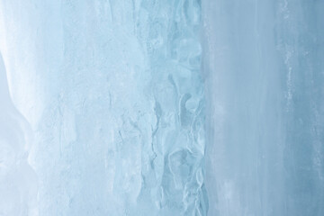 Abstract ice texture in a waterfall. View of the frozen waterfall texture from underneath it.