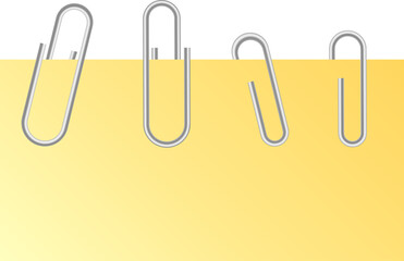 paper clips on yellow paper 