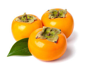 Three persimmon fruits with green leaves isolated on a white background generative AI