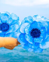 Vibrant blue flowers by the water