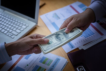 Business Hands money pocket and counting money American dollars, Office workers receive salary or bonus from executive or boss. loan and finance concep