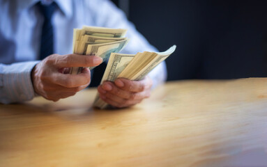 Business Hands money pocket and counting money American dollars, Office workers receive salary or bonus from executive or boss. loan and finance concep