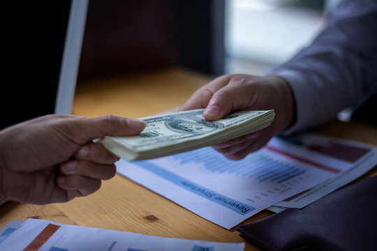 Business Hands money pocket and counting money American dollars, Office workers receive salary or bonus from executive or boss. loan and finance concep