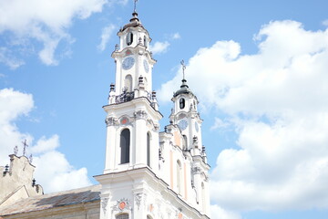 Obraz premium Stunning view of historic church towers against a bright blue sky in a serene setting
