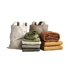 Organized textile collection featuring stacked linens and reusable tote bags in earthy, natural tones for sustainable living and home decor inspiration.