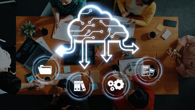 A diverse group of professionals collaborates in a modern office setting, utilizing cloud computing and digital strategies to enhance teamwork and facilitate innovation. Raster