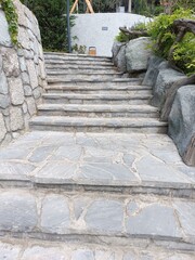 Marble stairs and part of a stone wall leading to the city park