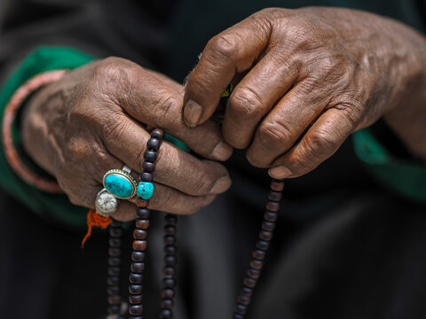 Tibetan Prayer Beads: Hands of Devotion in Ladakh