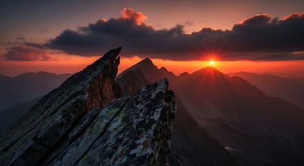 Dramatic Mountain Peaks Bathed in the Fiery Glow of a Majestic Sunset