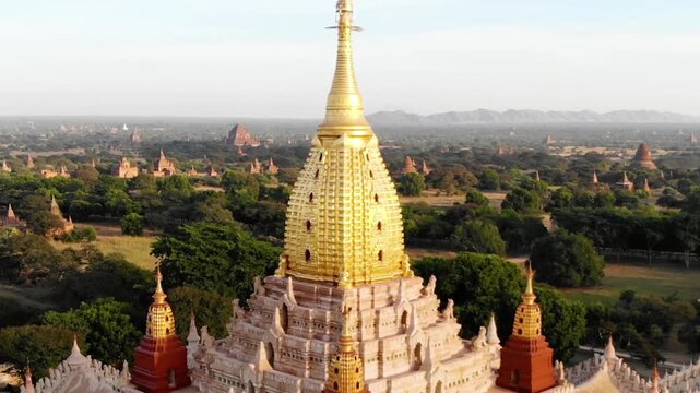 Golden pagoda rises above the ancient city of bagan in myanmar