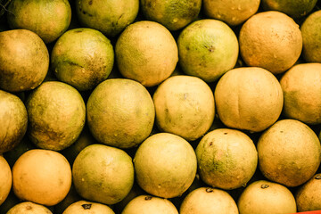 ripe oranges on a vibrant traditional market stall in Asia with natural colors