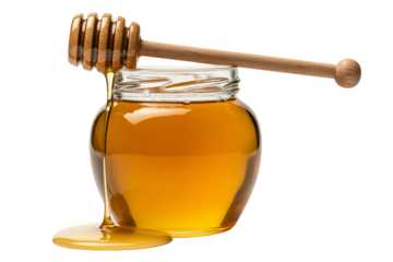 Rich golden honey drips from wooden dipper into glass jar