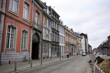 Row of historic houses along cobblestone street in Liege Belgium