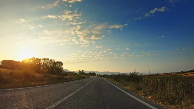 Sunset scenery, evening in the golden valley, POV driver perspective