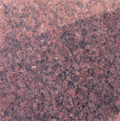 Polished red granite surface texture
