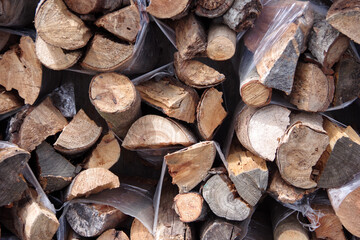 Stacked firewood bundles for sale