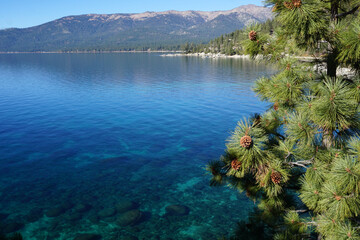 panoramic view of clear water, rocks and sand in beautiful lake Tahoe, Ca, USA, on a sunny day near Sand harbor