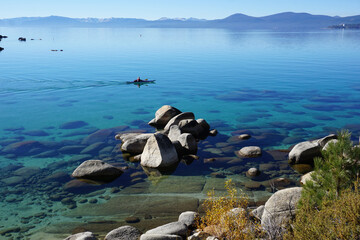 panoramic view of clear water, rocks and sand in beautiful lake Tahoe, Ca, USA, on a sunny day in Sand harbor