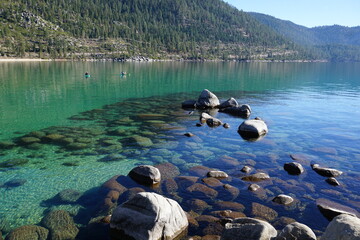 panoramic view of clear water, rocks and sand in beautiful lake Tahoe, Ca, USA, on a sunny day in Sand harbor