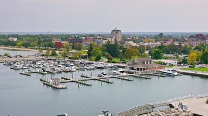 An aerial view of a harbor filled with boats in traverse city, michigan