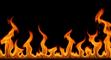 Fototapeta premium Bright Orange Fire Flames Glowing Against a Deep Black Background