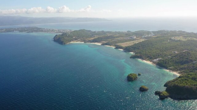 Aerial view of boracay islands coastline with turquoise waters and lush greenery