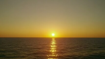 Stunning Golden Sunset Over Calm Ocean Water