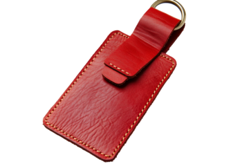 Red leather luggage tag with metal ring isolated on transparent background