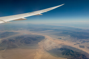 Aerial view of California Mountains, view from airplane window.
See less