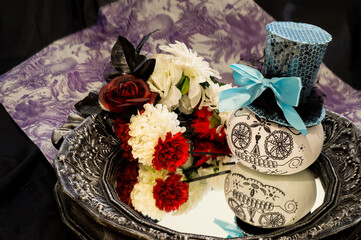 A very fashionable Catrina display with a typical flower headband on top of a mirror