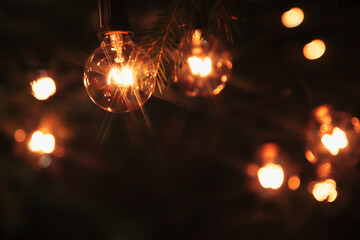 Background - electric garland with incandescent bulbs, yellow warm light