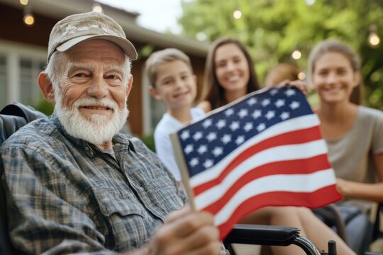 Senior veteran man holding american flag with family