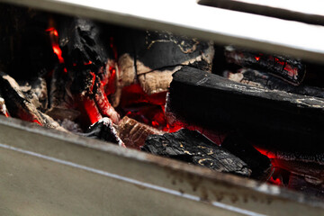 Burning Charcoal on Red Embers