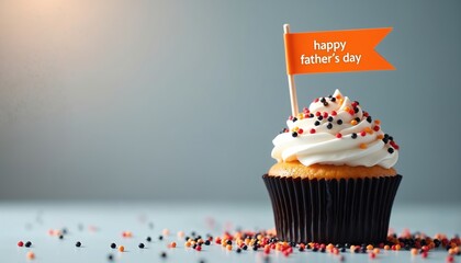 Festive cupcake with white frosting, colorful sprinkles, topped with orange flag wishing happy father day. Delicious homemade dessert perfect sweet treat for celebrating dads, special family