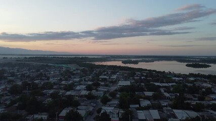 Aerial drone view, Cienaga magadelana city sunrise fog and rooftop 4k lakes and ocean - Powered by Adobe