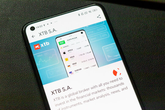 Warsaw, Poland - September 24, 2025: Display of XTB S.A. mobile application showcasing financial data and trading options for various instruments and analysis.