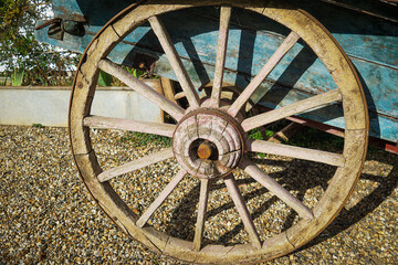 Antique wooden wagon wheel with spokes and central hub