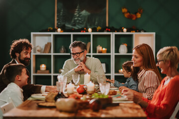 Family enjoying thanksgiving dinner together at home