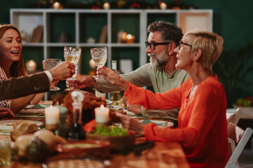 Family toasting during thanksgiving dinner celebration