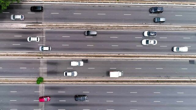 Aerial view of cars driving on a busy highway during the daytime