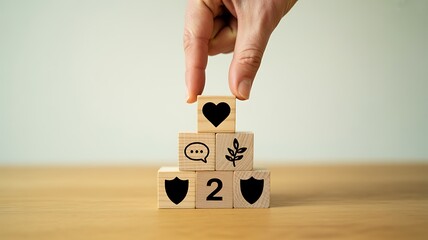 Hand Stacking Wooden Blocks with Icons and Number 2