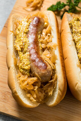 Homemade Beer Bratwursts on a Bun with Sauerkraut