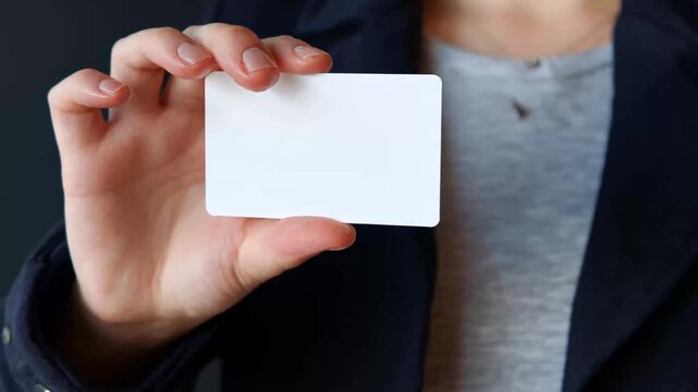 Person holding blank business card
