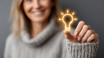 Creativity and Innovation Concept with Glowing Light Bulb in Hands