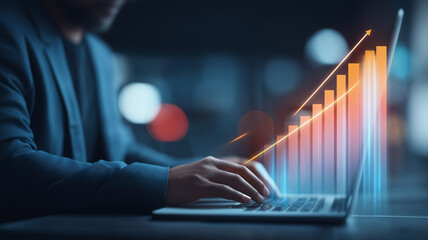 Business professional with laptop and ascending bar chart indicating strategy driven growth performance analysis and results oriented decision making for sustained success.
