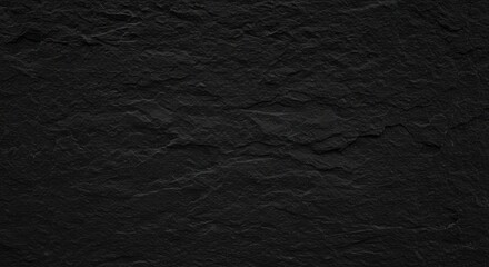 Close-up of a rough, dark, textured surface, revealing natural imperfections and patterns.