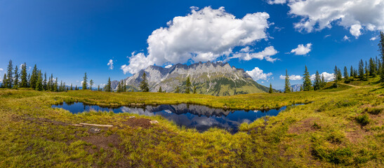 Panorama of Alps mountains on a sunny day. High resolution widescreen panorama of mountain...