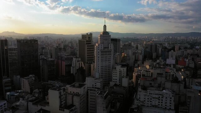 A cityscape view of so paulo, brazil at sunset with skyscrapers