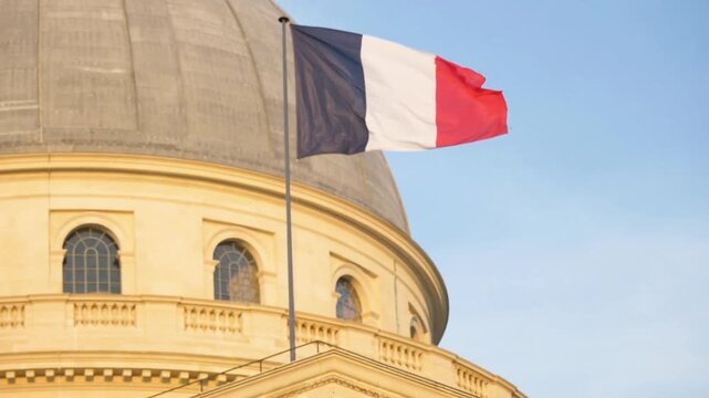 French flag waving proudly in front of the panthon in paris, france